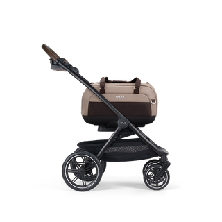 A Dupree II Pet Car Seat, in fawn, and attached to the Roscoe Trek 2.0 Pet Stroller Frame from a side profile