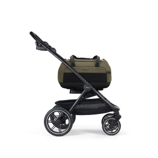 A Dupree II Pet Car Seat, in fern, and attached to the Roscoe Trek 2.0 Pet Stroller Frame from a side profile