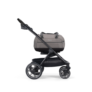 A Dupree II Pet Car Seat, in merle, and attached to the Roscoe Trek 2.0 Pet Stroller Frame from a side profile
