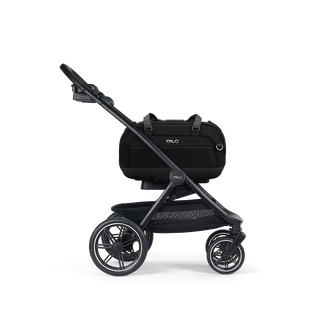 A Dupree II Pet Car Seat, in onyx, and attached to the Roscoe Trek 2.0 Pet Stroller Frame from a side profile