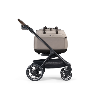 AHendrick Pet Car Seat, in tawny, and attached to the Roscoe Trek 2.0 Pet Stroller Frame from a side profile