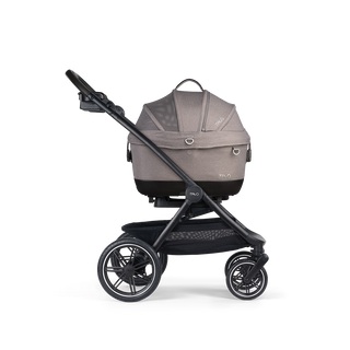 A Maeve iso 5x Pet Car Seat closed, in merle, and attached to the Roscoe Trek 2.0 Pet Stroller Frame from a side profile