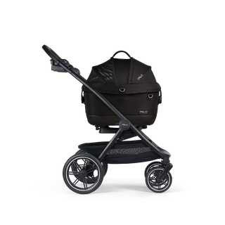 A Maeve iso 5x Pet Car Seat closed, in onyx, and attached to the Roscoe Trek 2.0 Pet Stroller Frame from a side profile