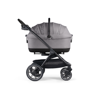 A Maeve iso 7x-L Pet Car Seat closed, in merle, and attached to the Roscoe Trek 2.0 Pet Stroller Frame from a side profile
