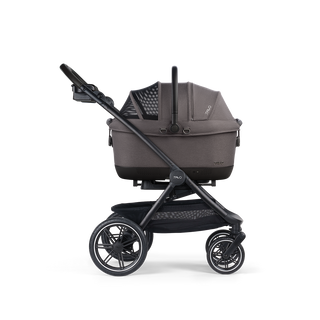 A Maeve iso Wind 6x Pet Car Seat closed, in ashen, and attached to the Roscoe Trek 2.0 Pet Stroller Frame from a side profile