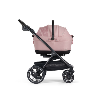 A Maeve iso Wind 6x Pet Car Seat closed, in sakura, and attached to the Roscoe Trek 2.0 Pet Stroller Frame from a side profile