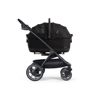 A Maeve iso Wind 7x-L Pet Car Seat closed, in onyx, and attached to the Roscoe Trek 2.0 Pet Stroller Frame from a side profile