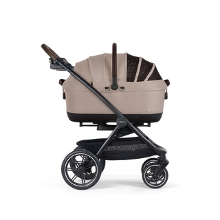 A Maeve iso Wind 7x-R Pet Car Seat closed, in fawn, sitting next to the Roscoe Trek 2.0 Pet Stroller Frame