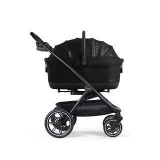 A Maeve iso Wind 7x-R Pet Car Seat closed, in onyx, and attached to the Roscoe Trek 2.0 Pet Stroller Frame from a side profile