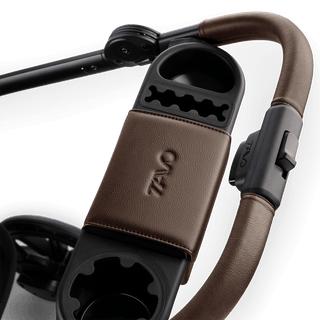 A Roscoe Trek 2.0 Pet Stroller frame in chocolate showing its orgnaizer bar closed