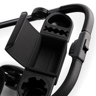 A Roscoe Trek 2.0 Pet Stroller frame in black showing its orgnaizer bar open