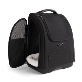 A Kamella Pet Backpack and Car Seat, in onyx,with one of the side doors unzipped