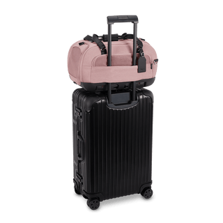 Dupree II pet car seat in the sakura fashion shown on top of luggage using the trolley sleeve