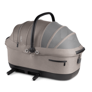 A Maeve iso 7x-L Pet Car Seat in the fashion merle on an angle with the ISOFIX latches out