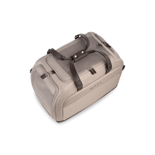 An tawny fashion Hendrick Pet Car Seat from the top showing its two handles and the top door zipped closed