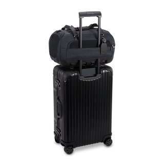 Dupree II pet car seat in the astral fashion shown on top of luggage using the trolley sleeve