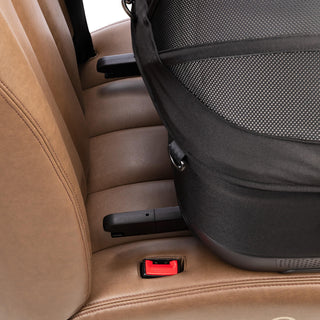 A close up image of the Maeve iso ISOFIX latches about to attach to the vehile anchor points of a car seat bench