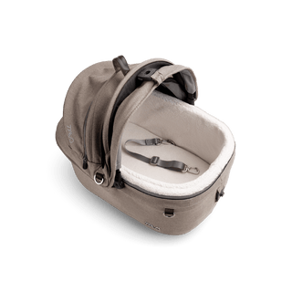 top view of beige small pet car seat with canopy open and leash with white comfort liner