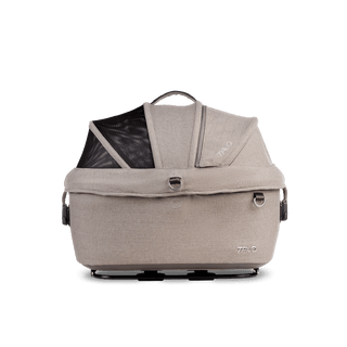 side view of beige small pet car seat with canopy closed