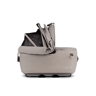 side view of beige small pet car seat with right side of canopy open